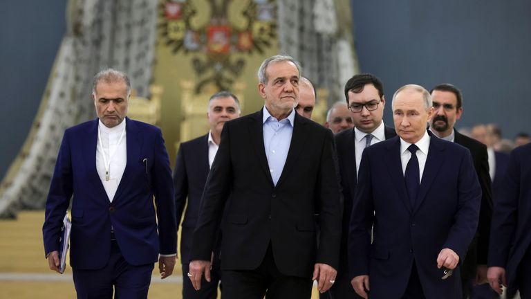 Masoud Pezeshkian (centre) and Vladimir Putin (right).
Pic: AP