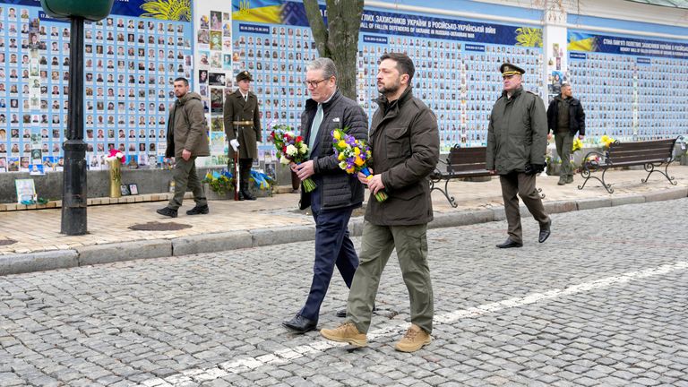 Keir Starmer and Volodymyr Zelenskyy arrive to lay wreaths at The Wall of Remembrance .
Pic: PA

