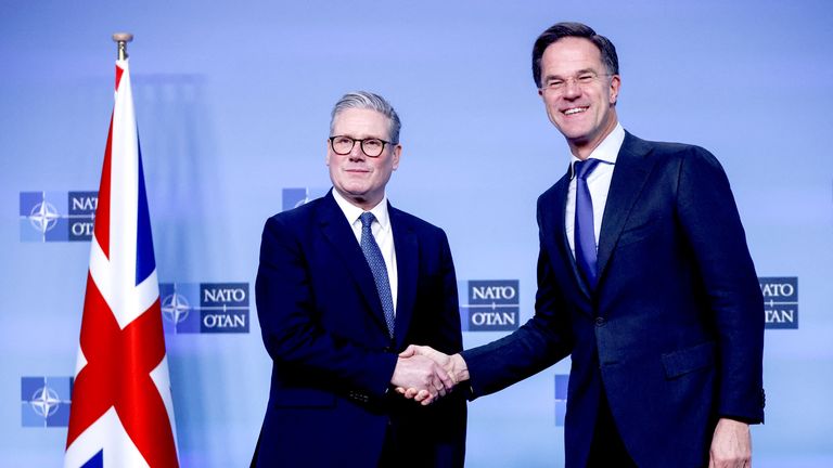 Keir Starmer shakes hands with NATO Secretary General Mark Rutte at the Alliance's headquarters in Brussels.
Pic: Reuters
