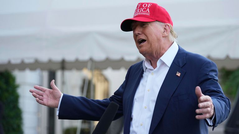 Donald Trump speaks to the media before walking across the South Lawn of the White House to board Marine One.
Pic AP